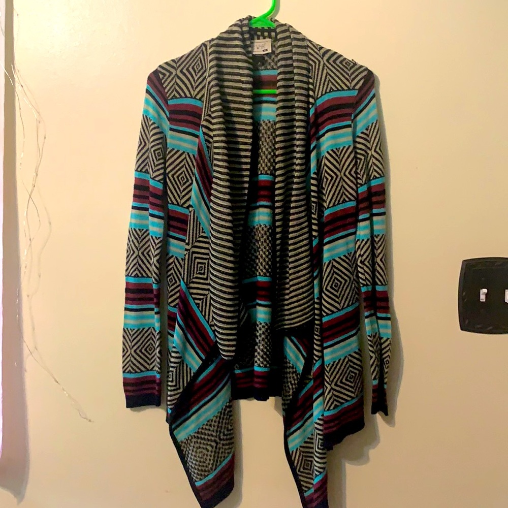 Maroon blue Black and Tan sweater.